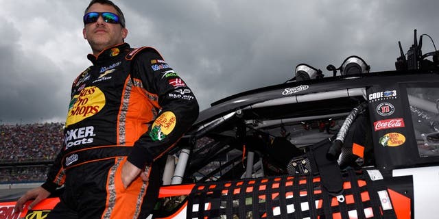 TALLADEGA, AL - MAY 01: Tony Stewart, driver of the #14 Bass Pro Shops Chevrolet, stands on the grid prior to the NASCAR Sprint Cup Series GEICO 500 at Talladega Superspeedway on May 1, 2016 in Talladega, Alabama. (Photo by Jared C. Tilton/Getty Images)
