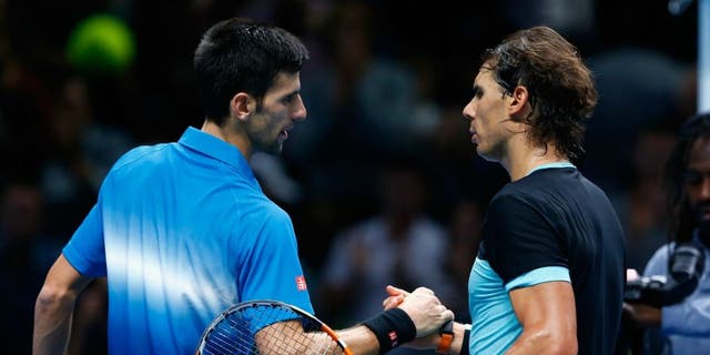 during the Barclays ATP World Tour Finals on Day Seven at O2 Arena on November 21, 2015 in London, England.,LONDON, ENGLAND - NOVEMBER 21: Novak Djokovic of Serbia is congratulated by Rafael Nadal of Spain in the semi final during the Barclays ATP World Tour Finals on Day Seven at O2 Arena on November 21, 2015 in London, England. (Photo by Julian Finney/Getty Images)
