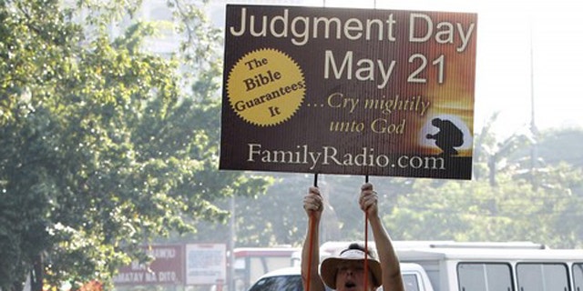 May 13: Debra Schaper of Maryland, who is a member of a religious group called Family Radio, displays a placard while spreading the group's prediction that the world will end on May 21, 2011.
