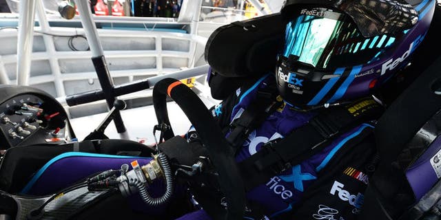 DOVER, DE - MAY 14: Denny Hamlin, driver of the #11 FedEx Office Toyota, sits in his car during practice for the NASCAR Sprint Cup AAA 400 Drive For Autism at Dover International Speedway on May 14, 2016 in Dover, Delaware. (Photo by Drew Hallowell/NASCAR via Getty Images)