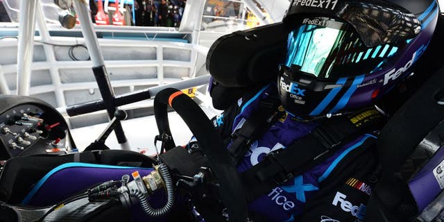 DOVER, DE - MAY 14: Denny Hamlin, driver of the #11 FedEx Office Toyota, sits in his car during practice for the NASCAR Sprint Cup AAA 400 Drive For Autism at Dover International Speedway on May 14, 2016 in Dover, Delaware. (Photo by Drew Hallowell/NASCAR via Getty Images)
