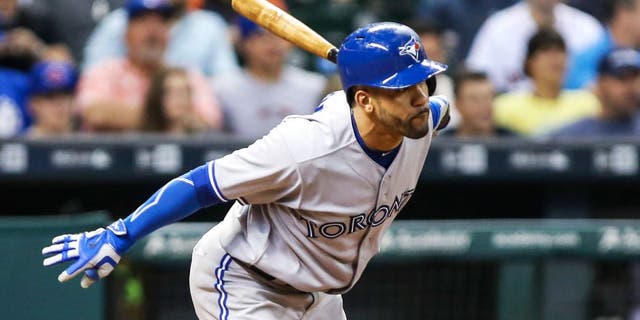 May 15, 2015; Houston, TX, USA; Toronto Blue Jays second baseman Devon Travis (29) gets a single during the seventh inning against the Houston Astros at Minute Maid Park. Mandatory Credit: Troy Taormina-USA TODAY Sports