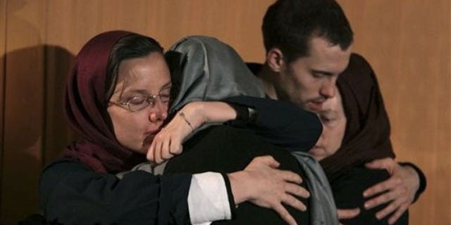May 21: Sarah Shourd, left, hugs her mother Nora Shourd, as Shane Bauer, second right, hugs his mother Cindy Hickey, during their meeting at the Esteghlal hotel in Tehran. The mothers of three Americans jailed in Iran for 10 months had more time with their children on Friday after an emotional reunion a day earlier in a Tehran hotel overlooking Evin prison, where the three have been held since their arrest in July along the Iran-Iraq border (AP).