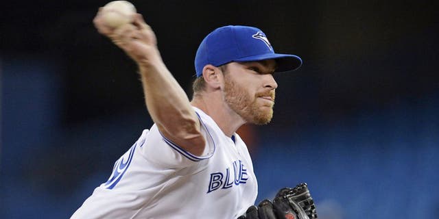 Toronto Blue Jays starting pitcher Liam Hendriks throws against the Oakland Athletics during the first inning of a baseball game Friday, May 23, 2014, in Toronto. (AP Photo/The Canadian Press, Frank Gunn)
