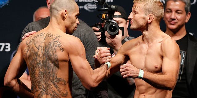 LAS VEGAS, NV - MAY 23: (L-R) Opponents Renan Barao and T.J. Dillashaw shake hands during the UFC 173 weigh-in at the MGM Grand Garden Arenaon May 23, 2014 in Las Vegas, Nevada. (Photo by Josh Hedges/Zuffa LLC/Zuffa LLC via Getty Images)