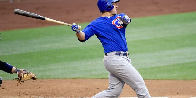 SAN DIEGO, CA - MAY 21: Miguel Montero #47 of the Chicago Cubs hits a double during the third inning of a baseball game against the San Diego Padres at Petco Park May 21, 2015 in San Diego, California. (Photo by Denis Poroy/Getty Images)