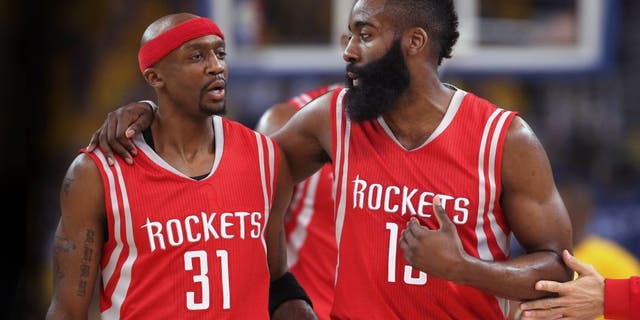 OAKLAND, CA - MAY 21: Jason Terry #31 and James Harden #13 of the Houston Rockets react after a play in the first quarter against the Golden State Warriors during game two of the Western Conference Finals of the 2015 NBA PLayoffs at ORACLE Arena on May 21, 2015 in Oakland, California. NOTE TO USER: User expressly acknowledges and agrees that, by downloading and or using this photograph, user is consenting to the terms and conditions of Getty Images License Agreement. (Photo by Ezra Shaw/Getty Images)