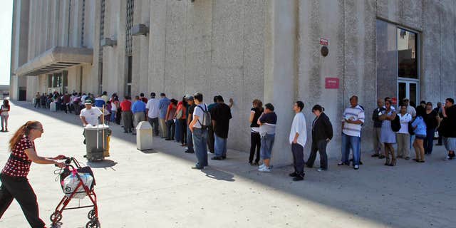 March 18, 2010: People line up outside the Metropolitan Courthouse, which handles traffic citations and other matters, in downtown Los Angeles.