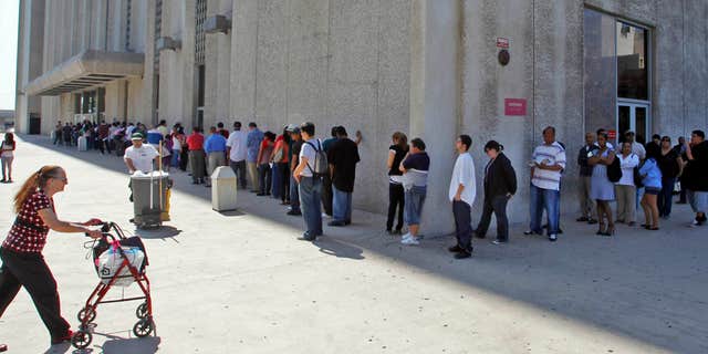 March 18, 2010: People line up outside the Metropolitan Courthouse, which handles traffic citations and other matters, in downtown Los Angeles.
