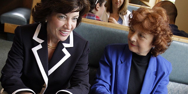 May 24: Democratic candidate for the 26th District Congressional seat, Kathy Hochul, left, talks with Debra Norton, right, and her husband Morrie Newman during a campaign stop at a restaurant in Amherst, N.Y.