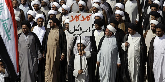 May 26: Supporters of cleric Muqtada al-Sadr march while holding a sign that reads, "no, no to Israel," in Arabic, in the Sadr City district of Baghdad, Iraq.