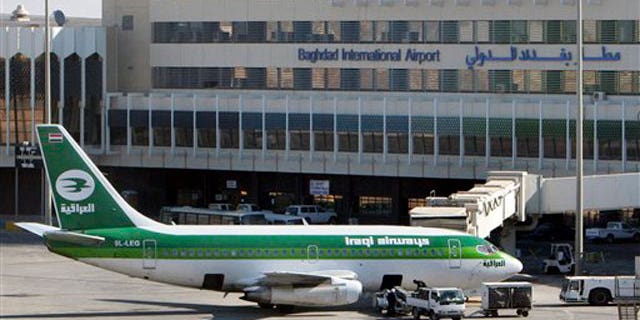 File: an Iraqi airways plane sits on the tarmac at Baghdad International Airport.