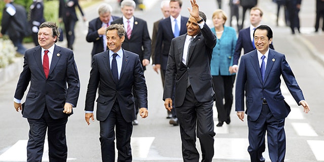 May 26: From left, European Commission President Jose Manuel Barroso, French President Nicolas Sarkozy, US President Barack Obama and Japanese Prime Minister Naoto Kan walk after a lunch meeting at the G8 summit in Deauville, France.