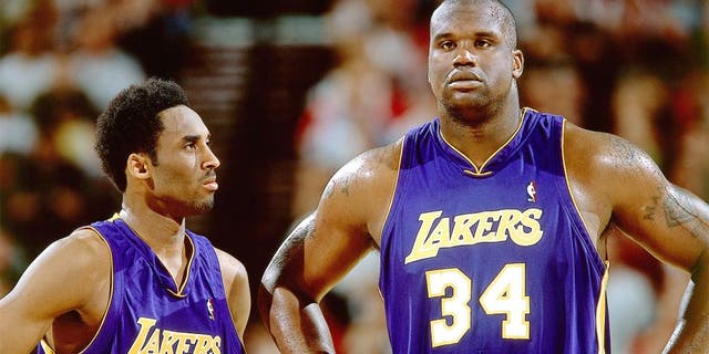 2001: Kobe Bryant #8 and Shaquille O'Neal #34 of the Los Angeles Lakers look on during an NBA game circa 2001. NOTE TO USER: User expressly acknowledges and agrees that, by downloading and/or using this Photograph, User is consenting to the terms and conditions of the Getty Images License Agreement. Mandatory Copyright Notice: Copyright 2001 NBAE (Photo by Sam Forencich/NBAE via Getty Images)