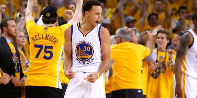 OAKLAND, CA - MAY 21: Stephen Curry #30 and Klay Thompson #11 of the Golden State Warriors react after defeating the Houston Rockets during game two of the Western Conference Finals of the 2015 NBA PLayoffs at ORACLE Arena on May 21, 2015 in Oakland, California. NOTE TO USER: User expressly acknowledges and agrees that, by downloading and or using this photograph, user is consenting to the terms and conditions of Getty Images License Agreement. (Photo by Ezra Shaw/Getty Images)