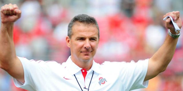 COLUMBUS, OHIO - SEPTEMBER 1, 2012: Head coach Urban Meyer of the Ohio State Buckeyes reacts to the chants of the fans before a game with the Miami Redhawks at Ohio Stadium in Columbus, Ohio. The Buckeyes won 56-10.(Photo by David Dermer/ Diamond Images/ Getty Images)
