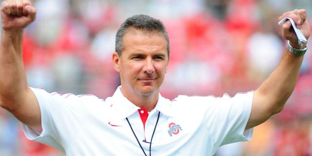 COLUMBUS, OHIO - SEPTEMBER 1, 2012: Head coach Urban Meyer of the Ohio State Buckeyes reacts to the chants of the fans before a game with the Miami Redhawks at Ohio Stadium in Columbus, Ohio. The Buckeyes won 56-10.(Photo by David Dermer/ Diamond Images/ Getty Images)