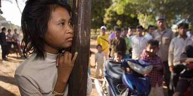 FILE: A woman dubbed the "jungle woman" after emerging naked and unable to speak from the wilds of northeastern Cambodia three years ago has apparently fled back to the forest, police said.