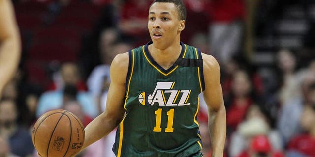 Apr 15, 2015; Houston, TX, USA; Utah Jazz guard Dante Exum (11) brings the ball up the court during the first quarter against the Houston Rockets at Toyota Center. Mandatory Credit: Troy Taormina-USA TODAY Sports
