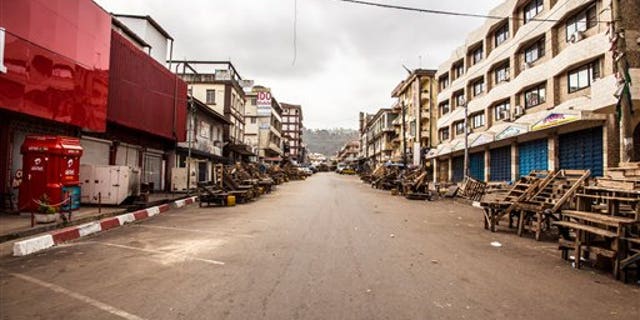 A usually busy street is deserted as Sierra Leone enters a three-day countrywide lockdown on movement of people due to the Ebola virus in the city of Freetown, Sierra Leone, Friday, March. 27,  2015. (AP Photo/ Michael Duff)