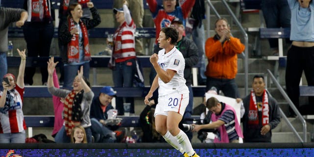 Abby Wambach celebrates her goal against Trinidad and Tobago in this Oct. 15, 2014, file photo.