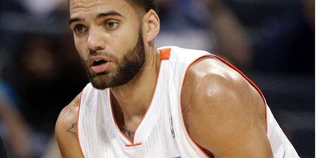 FILE - In this Nov. 10, 2012, file hoto, Charlotte Bobcats Jeffery Taylor listens to his coach during the first half of an NBA basketball game against the Dallas Mavericks in Charlotte, N.C. General manager Rich Cho said Monday, Sept. 29, 2014, that the Hornets are awaiting the outcome on an NBA investigation before deciding whether to reinstate Taylor following his arrest on domestic assault charges. (AP Photo/Chuck Burton, File)
