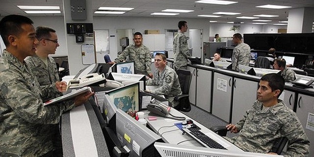 July 20, 2010: Personnel work at the Air Force Space Command Network Operations &amp; Security Center at Peterson Air Force Base in Colorado Springs.