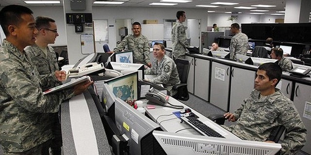 July 20, 2010: Personnel work at the Air Force Space Command Network Operations & Security Center at Peterson Air Force Base in Colorado Springs.