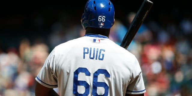 PHOENIX, AZ - APRIL 12: Yasiel Puig #66 of the Los Angeles Dodgers bats against the Arizona Diamondbacks during the MLB game at Chase Field on April 12, 2015 in Phoenix, Arizona. The Dodgers defeated the Diamondbacks 7-4. (Photo by Christian Petersen/Getty Images)