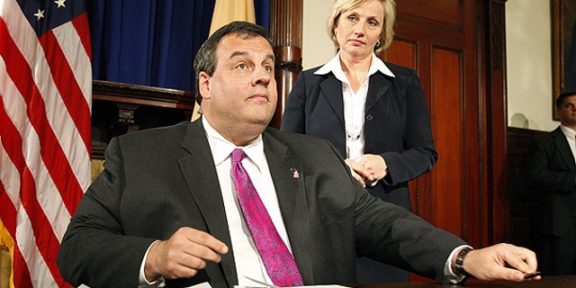 In this Thursday, May 20, 2010 file picture, Gov. Chris Christie reacts in Trenton, N.J. after vetoing a measure to restore a higher income tax on those making more than $1 million.