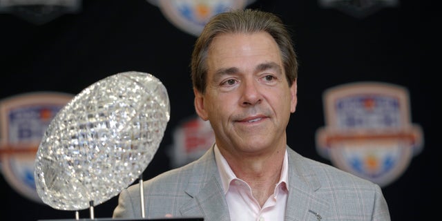 FILE -In a Jan. 8, 2013 file photo Alabama head coach Nick Saban poses with The Coaches' Trophy during a BCS National Championship college football game news conference in Ft. Lauderdale, Fla. By the time Dylan Moses is old enough to play football at Alabama, Nick Saban would be 65 and starting his 11th season at Tuscaloosa. (AP Photo/Morry Gash)
