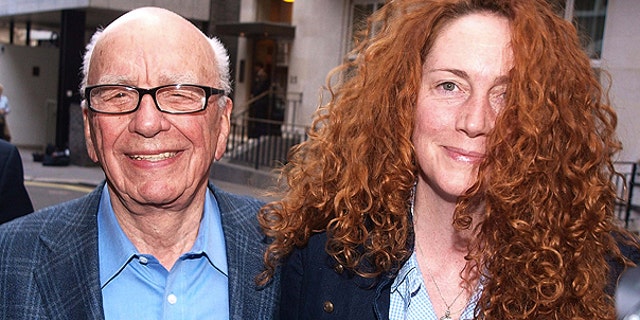 July 10: This photo shows Chairman of News Corporation Rupert Murdoch, left, and Chief executive of News International Rebekah Brooks as they leave his residence in central London.