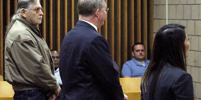 John Franklin McGraw, far left, listens to Cumberland County Assistant District Attorney Bella Troung during an appearance in Cumberland County District Court in Fayetteville, N.C., Wednesday, April 6, 2016. McGraw is charged in connection with an assault on a demonstrator at a Donald Trump campaign in Fayetteville last month. Both the defense and the prosecution agreed to the case being continued until July 13. (AP Photo/Skip Foreman)
