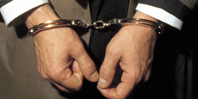 Person under arrest with handcuffs Detail of the handcuffed hands of a man under arrest  (Photo by Matias Nieto/Cover/Getty Images)