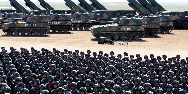 Soldiers of China's People's Liberation Army (PLA) take part in a military parade to commemorate the 90th anniversary of the foundation of the army at the Zhurihe military training base in Inner Mongolia Autonomous Region, China.