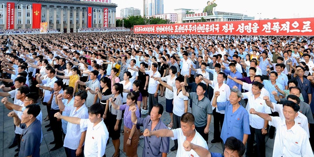 People participate in a Pyongyang city mass rally held at Kim Il Sung Square on August 9, 2017, to fully support the statement of the Democratic People's Republic of Korea (DPRK) government in this photo released on August 10, 2017 by North Korea's Korean Central News Agency (KCNA) in Pyongyang.