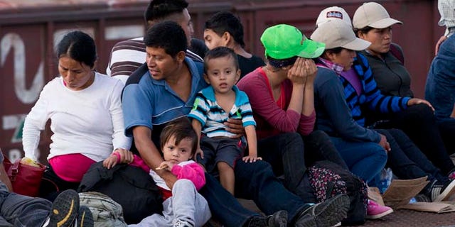 Central Americans ride a freight train toward the U.S.-Mexico border, on July 12, 2014.