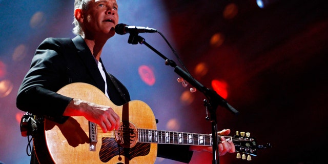 FILE - In this June 7, 2013 photo, Randy Travis performs on day 2 of the 2013 CMA Music festival at the LP Field in Nashville, Tenn.