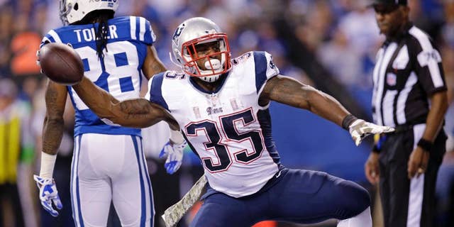 New England Patriots running back Jonas Gray celebrates after scoring a touchdown against the Indianapolis Colts during the first half of an NFL football game in Indianapolis, Sunday, Nov. 16, 2014. (AP Photo/AJ Mast)