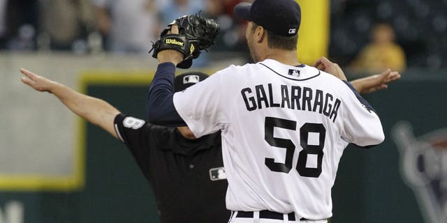 June 2: Detroit Tigers pitcher Armando Galarraga (58) looks at first base umpire Jim Joyce (partially obscured) who called Cleveland Indians' Jason Donald safe in the ninth inning of a baseball game.