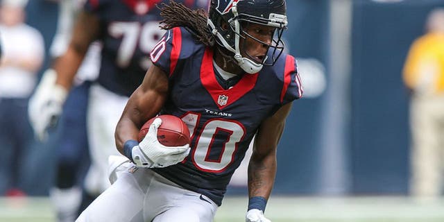 Dec 1, 2013; Houston, TX, USA; Houston Texans wide receiver DeAndre Hopkins (10) makes a reception during the first quarter against the New England Patriots at Reliant Stadium. The Patriots defeated the Texans 34-31. Mandatory Credit: Troy Taormina-USA TODAY Sports