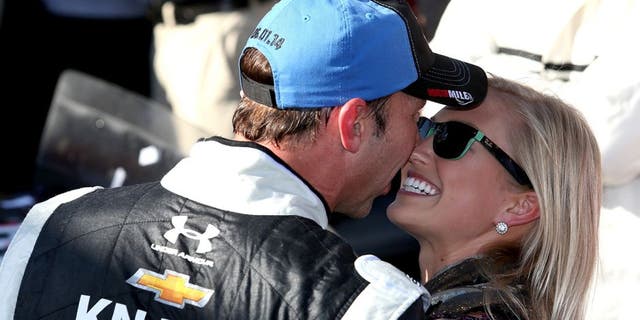 DOVER, DE - JUNE 01: Chad Knaus, crew chief of the #48 Lowe's/Kobalt Tools Chevrolet, celebrates with girlfriend Brooke Werner in Victory Lane after winning the NASCAR Sprint Cup Series FedEx 400 Benefiting Autism Speaks at Dover International Speedway on June 1, 2014 in Dover, Delaware. (Photo by Todd Warshaw/Getty Images)