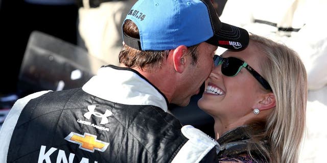 DOVER, DE - JUNE 01: Chad Knaus, crew chief of the #48 Lowe's/Kobalt Tools Chevrolet, celebrates with girlfriend Brooke Werner in Victory Lane after winning the NASCAR Sprint Cup Series FedEx 400 Benefiting Autism Speaks at Dover International Speedway on June 1, 2014 in Dover, Delaware. (Photo by Todd Warshaw/Getty Images)