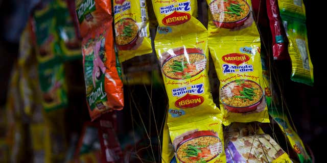 June 3, 2015: Packets of Maggi noodles hang on display at a shop in New Delhi, India.