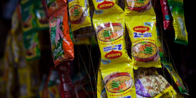 June 3, 2015: Packets of Maggi noodles hang on display at a shop in New Delhi, India.