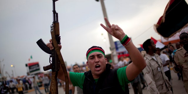 June 3: A man chants anti-Muammar al-Qaddafi slogans during a protest in the rebel strong hold of Benghazi, Libya.
