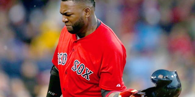 BOSTON, MA - JUNE 3: David Ortiz #34 of the Boston Red Sox throws his helmet after making an out in the fourth inning against the Minnesota Twins during the second game of a doubleheader at Fenway Park on June 3, 2015 in Boston, Massachusetts. (Photo by Jim Rogash/Getty Images)
