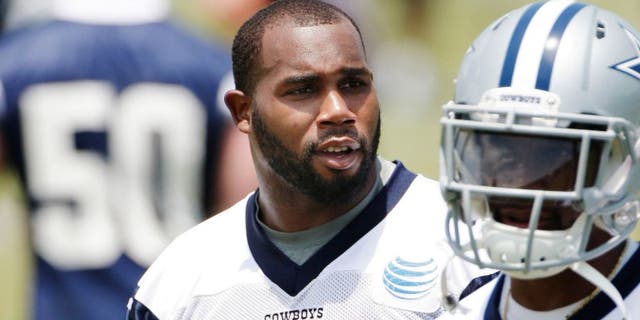 Dallas Cowboys running backs Joseph Randle (21) and Darren McFadden (20) look on during an NFL football organized team activity, Wednesday, May 27, 2015, in Irving, Texas. (AP Photo/Brandon Wade)