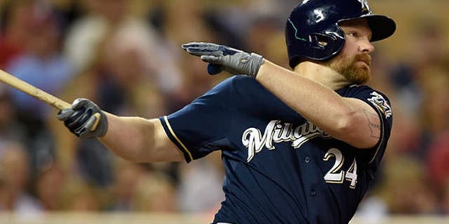 MINNEAPOLIS, MN - JUNE 5: Adam Lind #24 of the Milwaukee Brewers hits an RBI double against the Minnesota Twins during the eighth inning of the game on June 5, 2015 at Target Field in Minneapolis, Minnesota. The Brewers defeated the Twins 10-5. (Photo by Hannah Foslien/Getty Images)