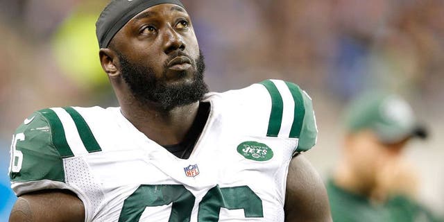 DETROIT, MI - NOVEMBER 24: Muhammad Wilkerson #96 of the New York Jets watches the action from the silde lines during the game against the Buffalo Bills at Ford Field on November 24, 2014 in Detroit, Michigan. The Bills defeated the Jets 38-3. (Photo by Leon Halip/Getty Images)